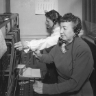 Switchboard operators on first floor.