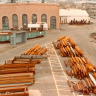 In the foreground is a long row of unused rust-covered fan shafts.